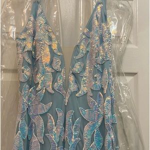 Jovanni Lt blue - iridescent size 18.  Paid $700 castle contour worn  once